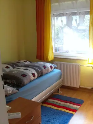 Ein Bett oder Betten in einem Zimmer der Unterkunft Ferienwohnung Mörlenbach