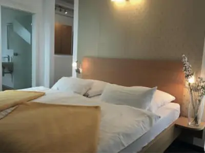 Ein Bett oder Betten in einem Zimmer der Unterkunft Hotel Kurpfalz