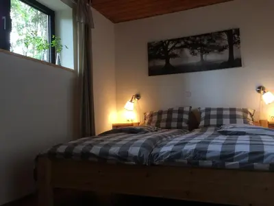 Ein Bett oder Betten in einem Zimmer der Unterkunft Grimm`s Waldhäuschen