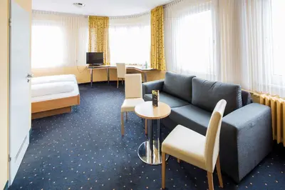 Ein Bett oder Betten in einem Zimmer der Unterkunft Central Hotel