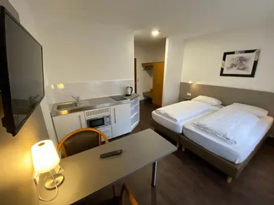 Ein Bett oder Betten in einem Zimmer der Unterkunft Hotel am Schillerplatz