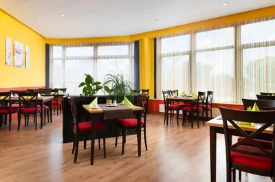 Ein Restaurant oder anderes Speiselokal in der Unterkunft ates Hotel Lampertheim by AURUM