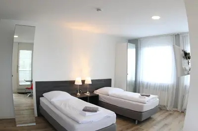 Ein Bett oder Betten in einem Zimmer der Unterkunft looks-inn