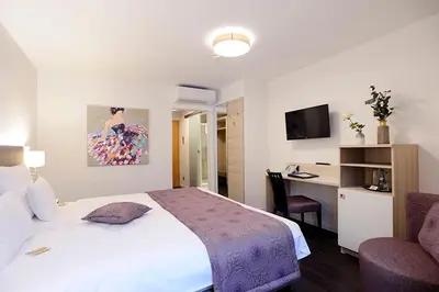 Ein Bett oder Betten in einem Zimmer der Unterkunft Schlosshotel Ingelfingen