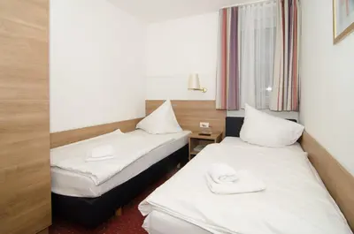 Ein Bett oder Betten in einem Zimmer der Unterkunft Hotel -Restaurant Taormina
