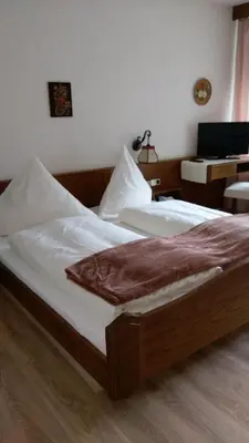 Ein Bett oder Betten in einem Zimmer der Unterkunft Hotel-Restaurant Jägerhof