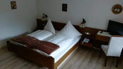Ein Bett oder Betten in einem Zimmer der Unterkunft Hotel-Restaurant Jägerhof