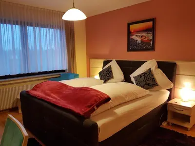 Ein Bett oder Betten in einem Zimmer der Unterkunft Legend Hotel