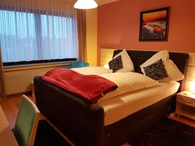 Ein Bett oder Betten in einem Zimmer der Unterkunft Legend Hotel