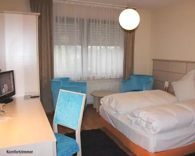 Ein Bett oder Betten in einem Zimmer der Unterkunft Legend Hotel