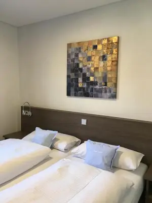 Ein Bett oder Betten in einem Zimmer der Unterkunft Gästehaus zur Sonne