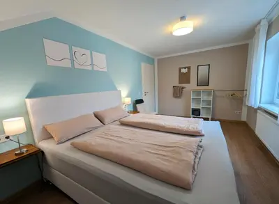 Ein Bett oder Betten in einem Zimmer der Unterkunft Ferienwohnung auf dem Dorf, Külsheim