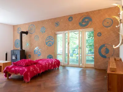 Ein Bett oder Betten in einem Zimmer der Unterkunft Suite Martinus am Vortexgarten Mathildenhöhe