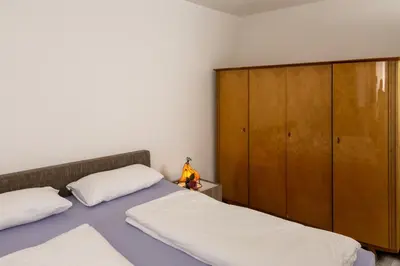 Ein Bett oder Betten in einem Zimmer der Unterkunft Ferienwohnung im Paradiesgarten