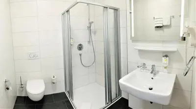Ein Badezimmer in der Unterkunft Garni-Hotel zur Krone