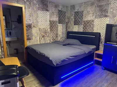 Ein Bett oder Betten in einem Zimmer der Unterkunft Hotel Mythos 