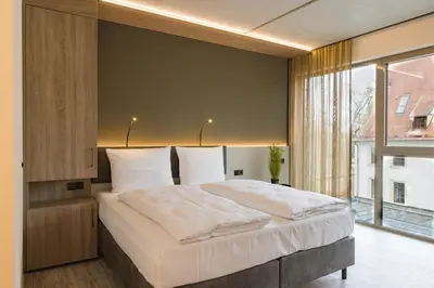 Ein Bett oder Betten in einem Zimmer der Unterkunft Hotel Schloss Lehen