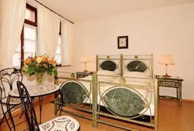 Ein Bett oder Betten in einem Zimmer der Unterkunft L´Antica Ruota - Zum Alten Wasserrad