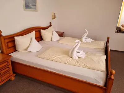 Ein Bett oder Betten in einem Zimmer der Unterkunft Landgasthaus Römerhof