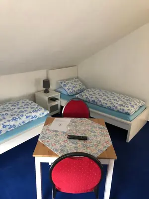 Ein Bett oder Betten in einem Zimmer der Unterkunft Urberacher Hof