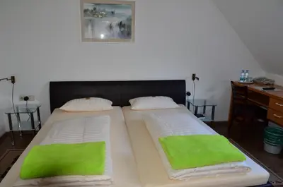 Ein Bett oder Betten in einem Zimmer der Unterkunft Hotel Mörike