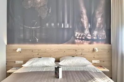 Ein Bett oder Betten in einem Zimmer der Unterkunft ART-Hotel Braun