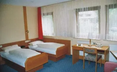 Ein Bett oder Betten in einem Zimmer der Unterkunft Hotel Ludwigstal