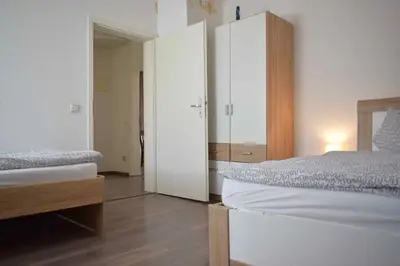 Ein Bett oder Betten in einem Zimmer der Unterkunft Ferienwohnung Gruppenhaus bis 12 Personen