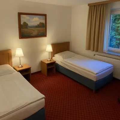 Ein Bett oder Betten in einem Zimmer der Unterkunft Hotel Schillerplatz