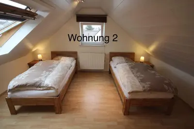 Ein Bett oder Betten in einem Zimmer der Unterkunft Ferienwohung Weinheim