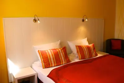 Ein Bett oder Betten in einem Zimmer der Unterkunft Casa Hotel Neu-Isenburg