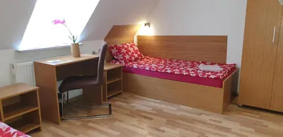 Ein Bett oder Betten in einem Zimmer der Unterkunft Pension Haus Baron 1 Neckarau