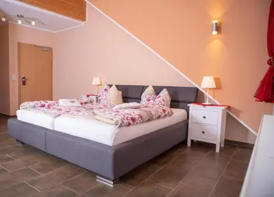 Ein Bett oder Betten in einem Zimmer der Unterkunft Weingut und Gästehaus Wetzler