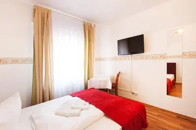 Ein Bett oder Betten in einem Zimmer der Unterkunft Pension Jasmin