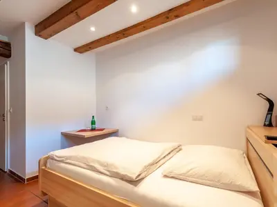 Ein Bett oder Betten in einem Zimmer der Unterkunft Gästezimmer im Weingut Wolf