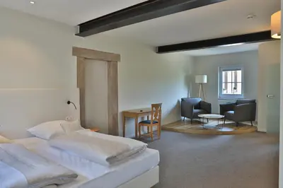 Ein Bett oder Betten in einem Zimmer der Unterkunft Landidyll Hotel Klostermühle