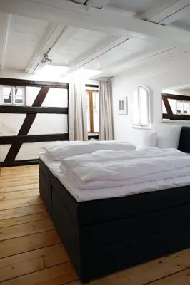 Ein Bett oder Betten in einem Zimmer der Unterkunft Fachwerkhaus Maximilian