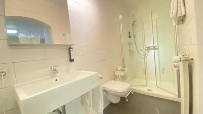 Ein Badezimmer in der Unterkunft Haus am Heiner Geißler Platz by Landgasthof Zickler