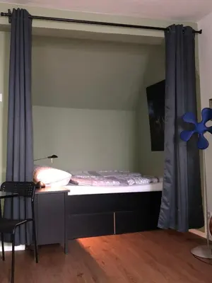 Ein Bett oder Betten in einem Zimmer der Unterkunft Gästewohnung im Logenhaus