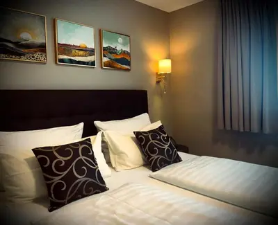 Ein Bett oder Betten in einem Zimmer der Unterkunft Hotel Regina