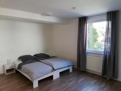 Ein Bett oder Betten in einem Zimmer der Unterkunft Gästehaus by Becker