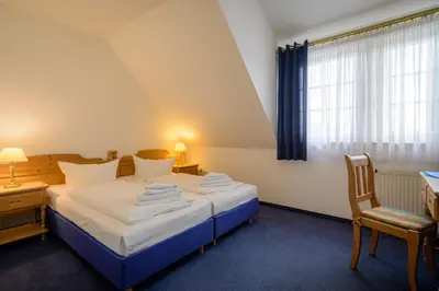 Ein Bett oder Betten in einem Zimmer der Unterkunft Hotel ZUM ENGEL in Speyer - Römerberg