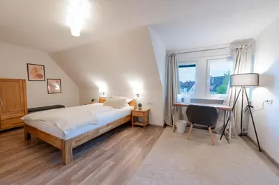 Ein Bett oder Betten in einem Zimmer der Unterkunft Westend Hotel