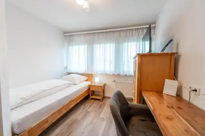 Ein Bett oder Betten in einem Zimmer der Unterkunft Westend Hotel