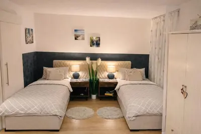 Ein Bett oder Betten in einem Zimmer der Unterkunft Apartment Messe Karlsruhe