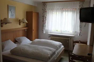Ein Bett oder Betten in einem Zimmer der Unterkunft Gasthof Jäger