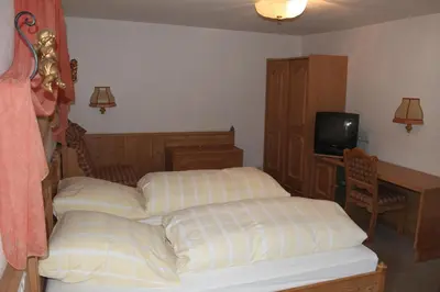 Ein Bett oder Betten in einem Zimmer der Unterkunft Gasthof Jäger