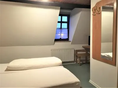 Ein Bett oder Betten in einem Zimmer der Unterkunft Gasthaus Löwen