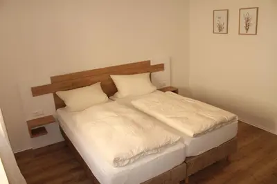 Ein Bett oder Betten in einem Zimmer der Unterkunft Gasthaus Löwen