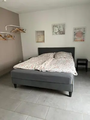 Ein Bett oder Betten in einem Zimmer der Unterkunft Gemütliches Apartment nahe Porsche